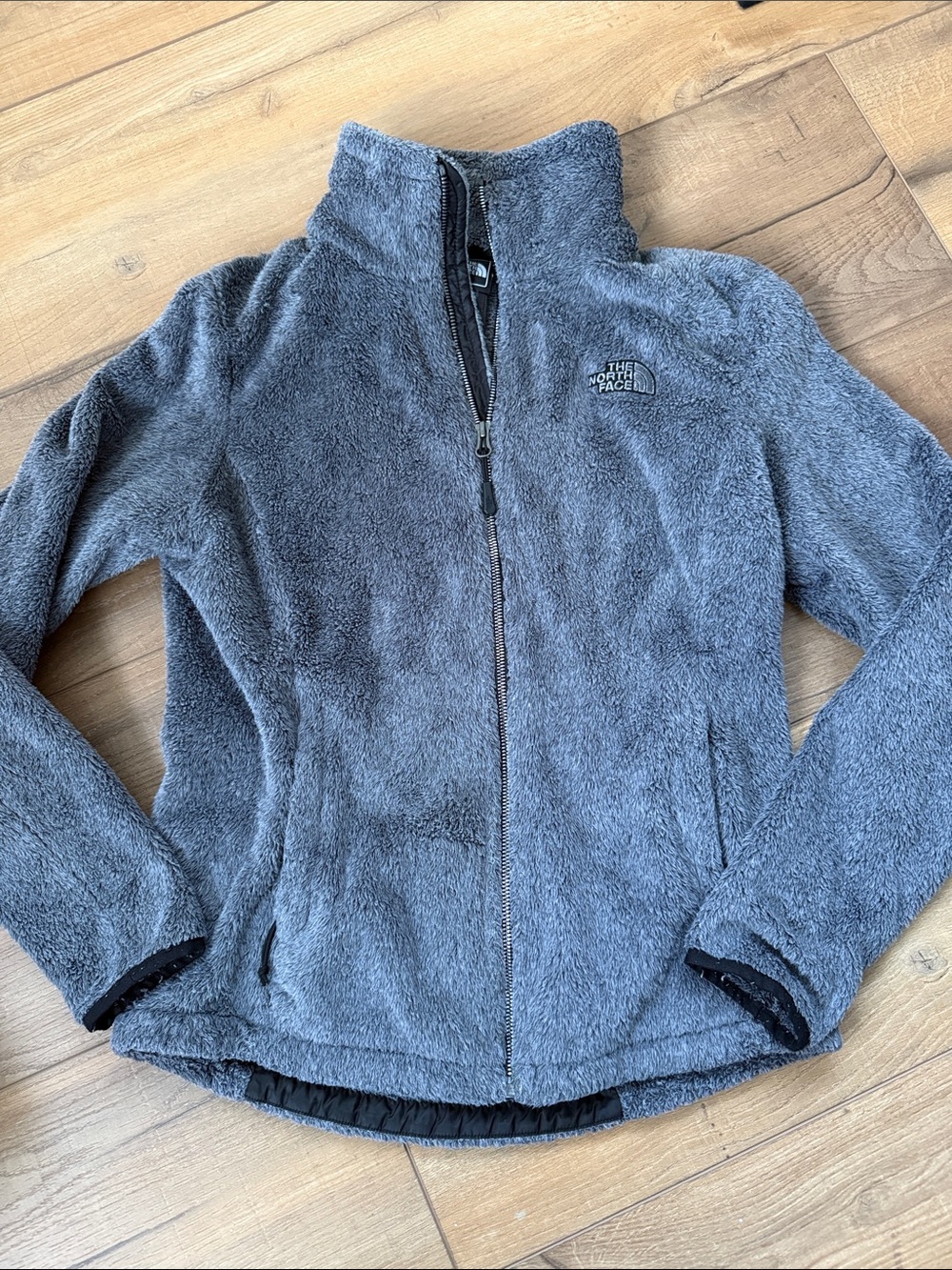 Women The North Face Osito Fleece Jacket in a grey color with a full-zip closure